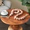 5ft. Paper Mache Round Distressed Beaded Garland with Tassel